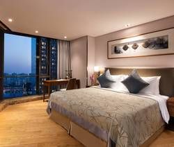 Comfortable Bedroom of a Three-Bedroom Deluxe at Somerset Baitang Suzhou