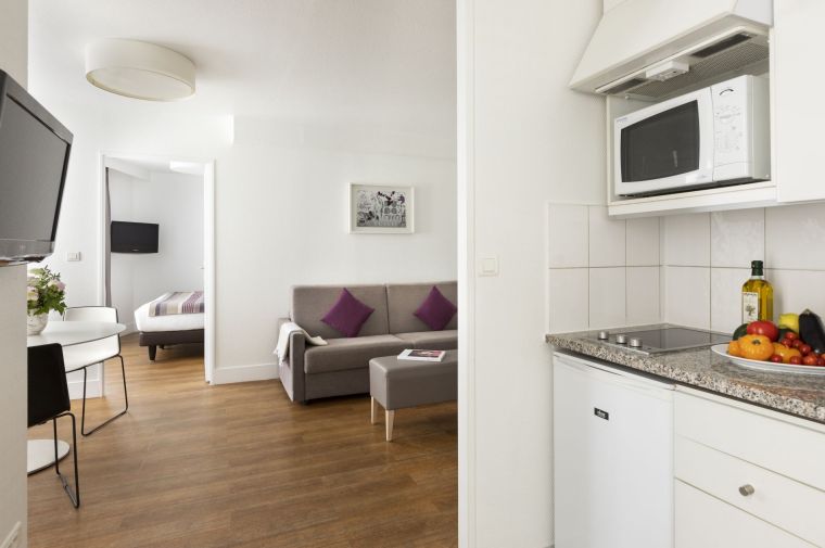 Fully equipped kitchen of a 1-Bedroom Apartment, apart hotel Paris 11