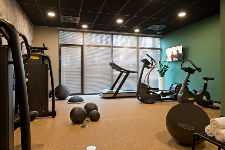 Fitness centre equipped with treadmill, gym ball and elliptical bike, apart hotel Strasbourg