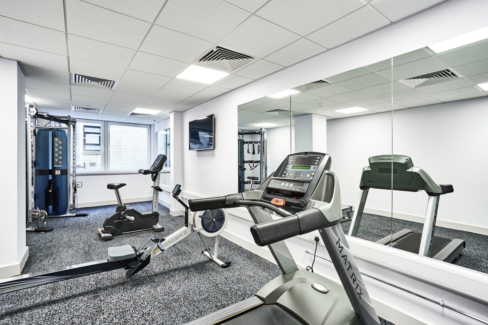 Fitness room equipped with treadmill, rowing machine and elliptical bikes, Apart hotel Liverpool
