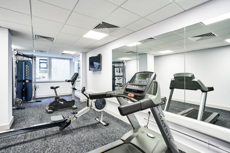 Fitness room equipped with treadmill, rowing machine and elliptical bikes, Apart hotel Liverpool
