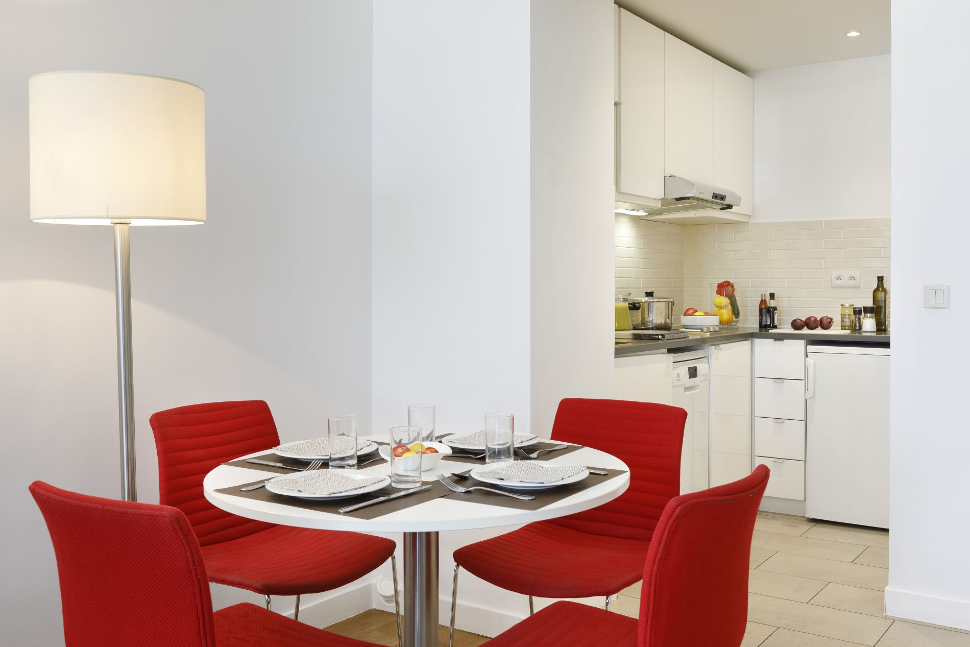 Fully equipped kitchen of a 1-Bedroom Apartment and its dining area, apart hotel Paris 14